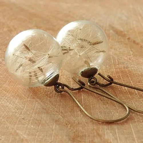 2 pares aretes con forma de globo y semilla de diente de león