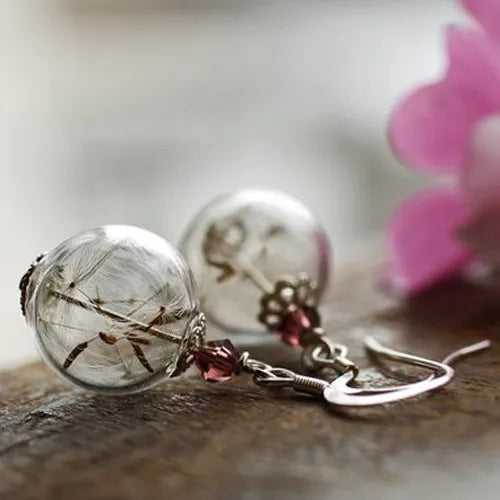 2 pares aretes con forma de globo y semilla de diente de león